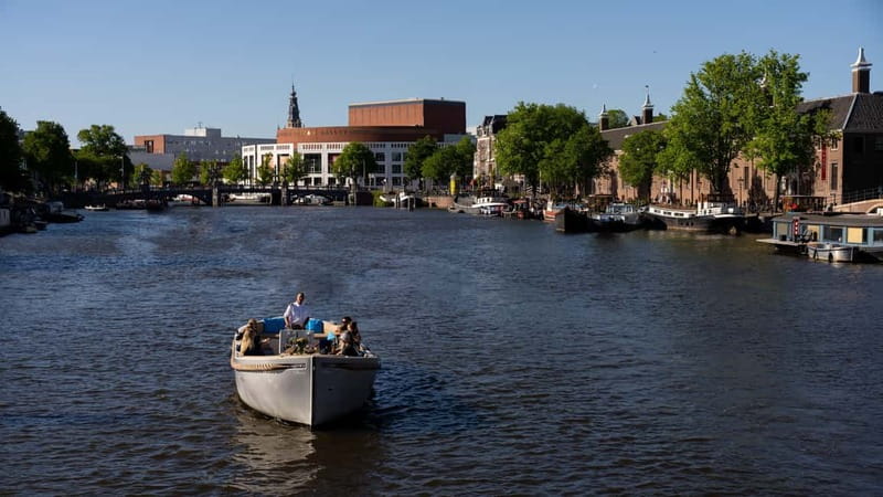 Amsterdam: Canal Cruise in Open Boat with Drink Option - Herengracht, the Dancing Houses, and the Seven Bridges area