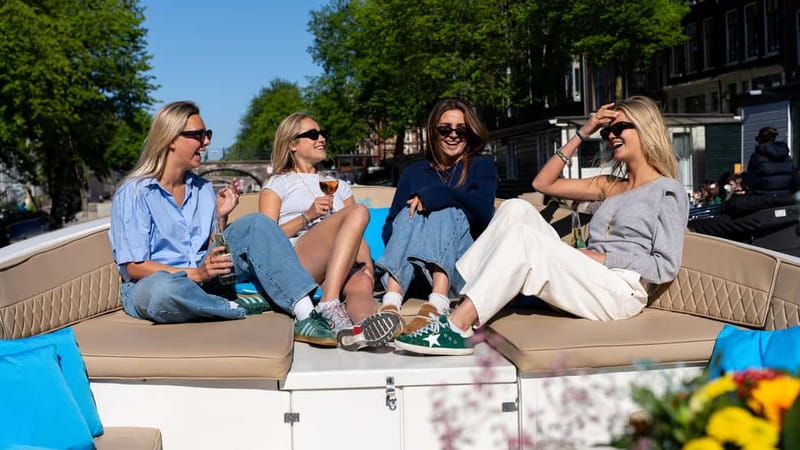 Amsterdam: Canal Cruise in Open Boat with Drink Option - What the live guiding adds