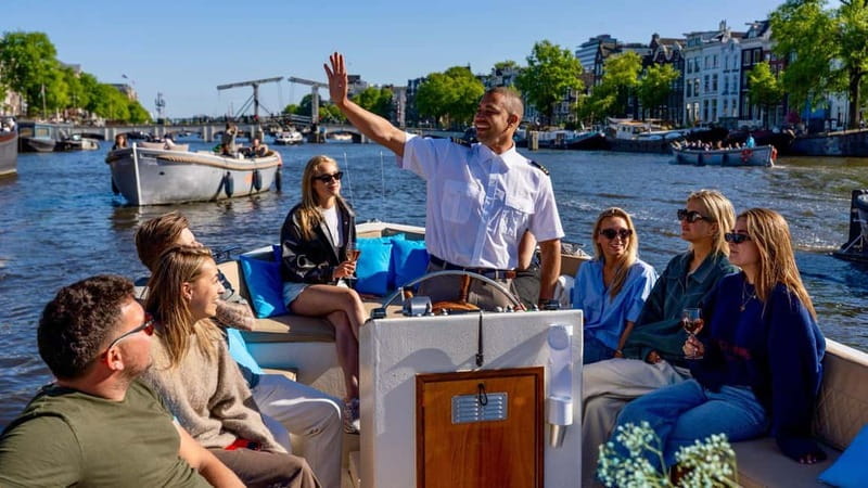 Amsterdam: Canal Cruise in Open Boat with Drink Option - Choosing between Central Station and Anne Frank House
