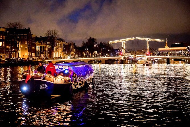 Amsterdam Canal Cruise With Live Guide and Unlimited Drinks - The boat, seating, and weather plan