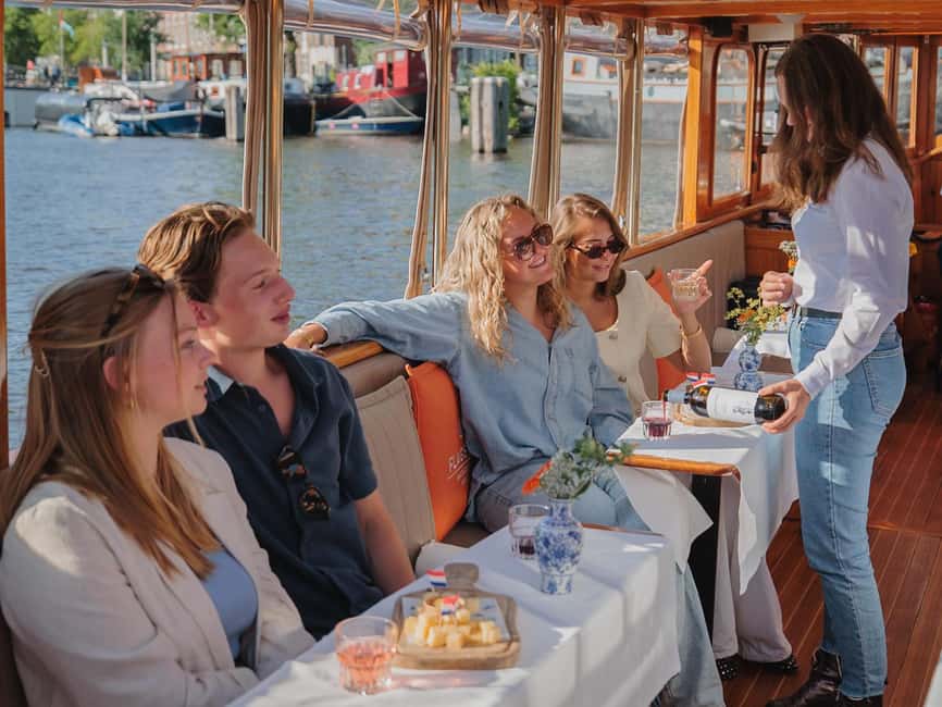 Amsterdam: Classic Saloon Boat Cruise with Cheese & Wine - Why Amsterdam’s canals are best seen from a low boat