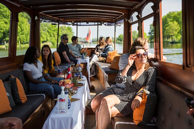 Amsterdam Classic Saloon Boat Cruise with Drinks and Cheese - The Amstel and Skinny Bridge