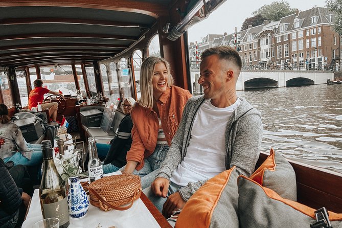 Amsterdam Classic Saloon Boat Cruise with Drinks and Cheese - Rijksmuseum, flower market, and the central sights
