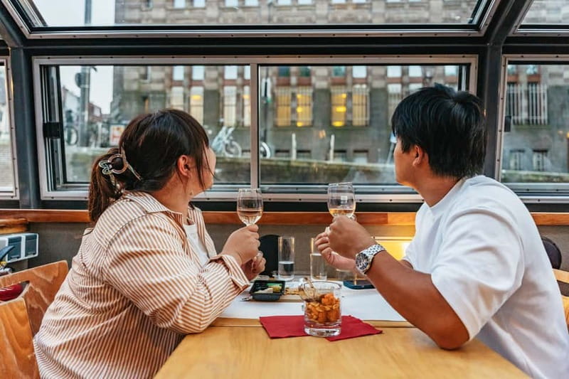 Amsterdam: Cozy Cheese & Wine Cruise Tasting Experience - The Captain and Host Shape the Evening