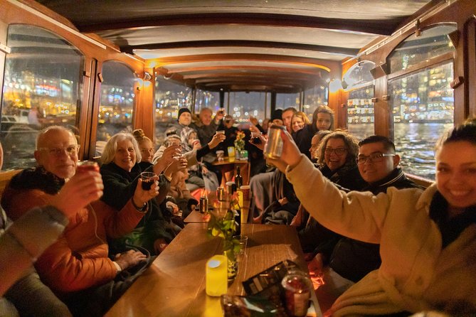 Amsterdam Evening Canal Cruise with Live Guide and Onboard Bar - Boat comfort, weather, and the biggest booking caution