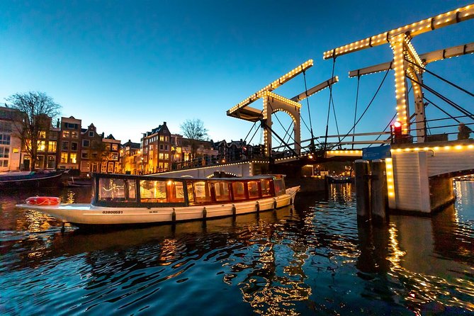 Amsterdam Evening Canal Cruise with Live Guide and Onboard Bar - Drinks, cheese, and the onboard setup