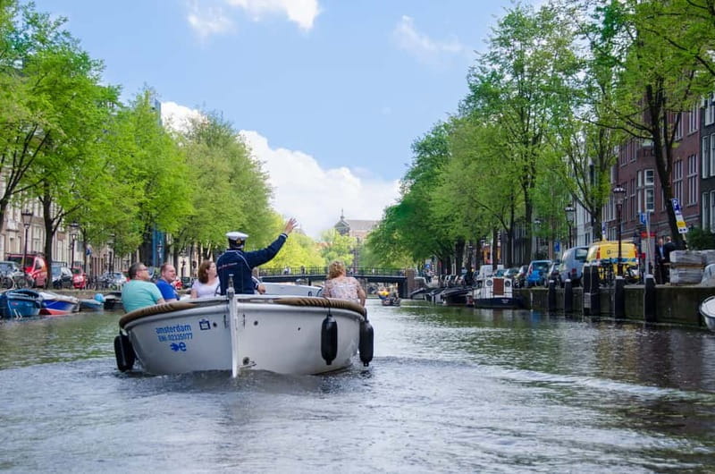Amsterdam: Guided City Highlights Open Boat Canal Cruise - Why the small open boat changes the ride