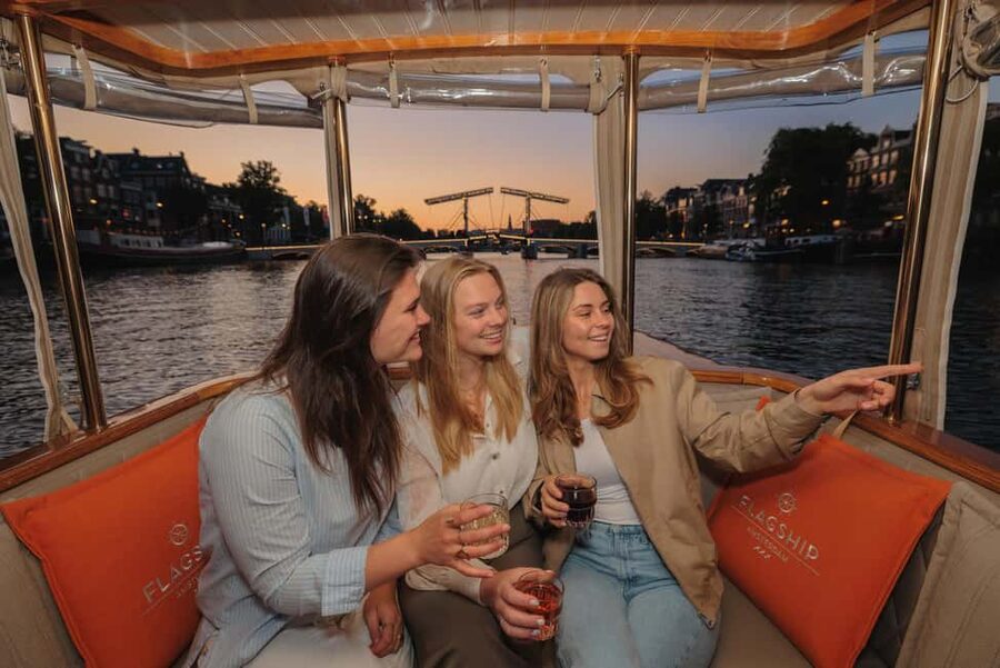 Amsterdam: Heated Canal Cruise with Unlimited Drinks & Bite - Seeing Amsterdam from a heated electric boat