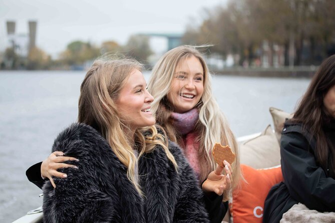 Amsterdam: Luxury Saloon Boat Cruise with Cocktails & Waffle - Central Station, the Kolksluice, and the city’s northern edge