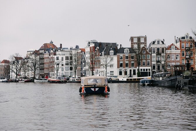 Amsterdam Newest Canal Cruise with local guide and small group - The old tower, the Amstel, and the Blue Bridge