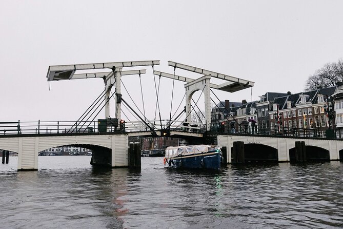 Amsterdam Newest Canal Cruise with local guide and small group - Leaning houses, the Oude Kerk, and De Wallen