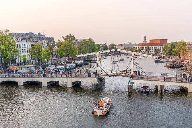 Amsterdam: Saloon Boat Cruise + Unlimited Drinks & Bite option - The UNESCO canal ring in one compact hour