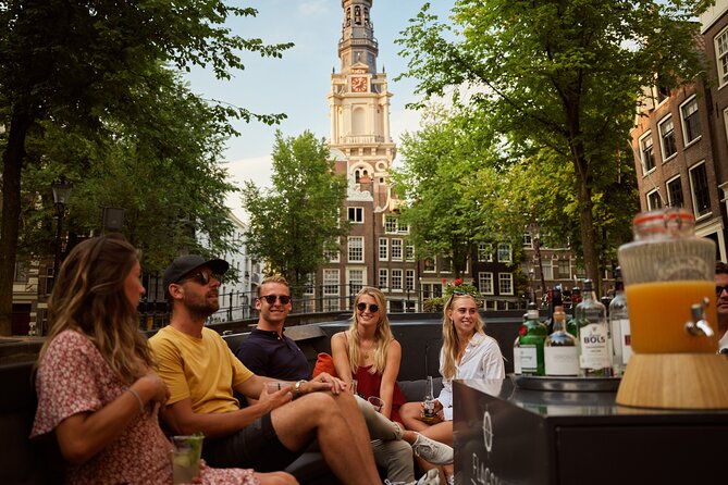 Amsterdam: Saloon Boat Cruise + Unlimited Drinks & Bite option - Zuiderkerk and the skyline in close view