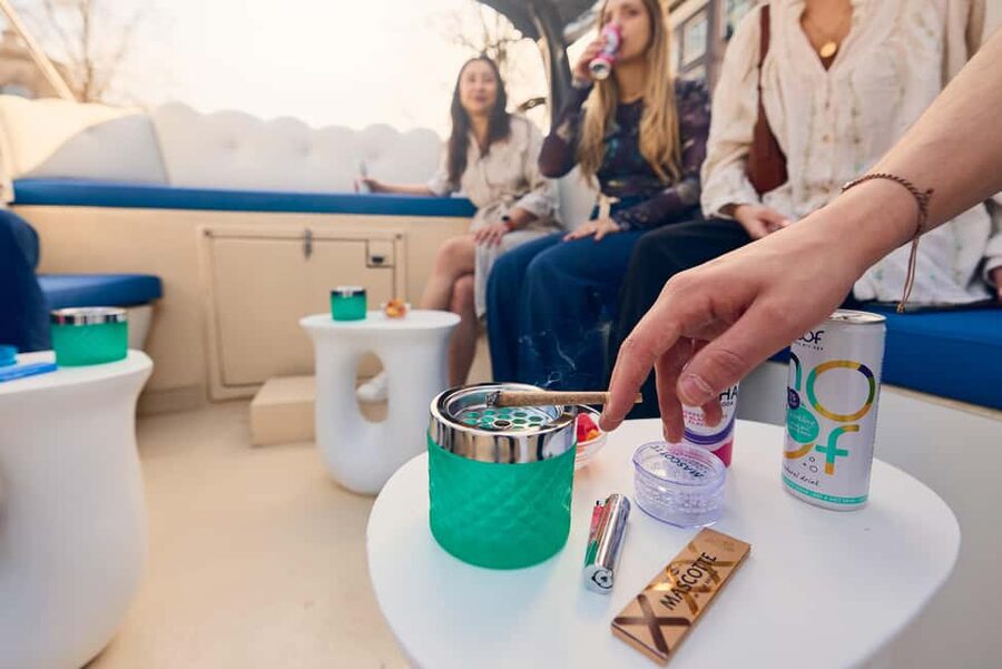 Amsterdam: Smoke & Cruise on covered Cannabis Boat With Bar - Fifteen minutes through Amsterdam’s central canals