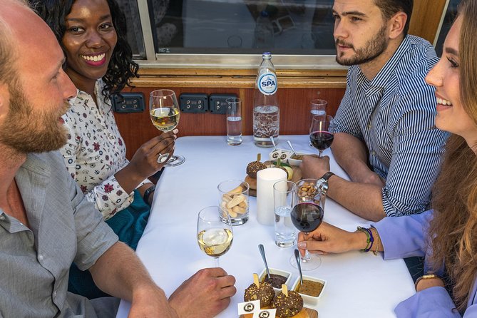 Amsterdam: Wine and Cheese Evening Cruise - Boarding the boat and settling in