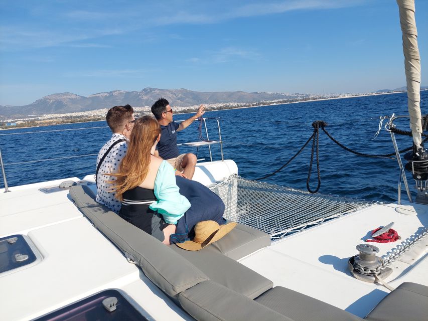 Athens: Catamaran Cruise with Fresh Lunch and Wine - Vouliagmeni Bay and the rocky coast