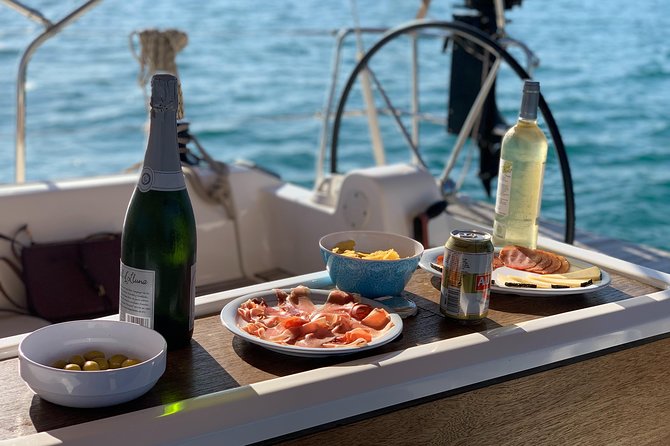 Barcelona Sailing: Light Snacks & Open Bar with Private Option - Returning past Barceloneta and Palau de Mar