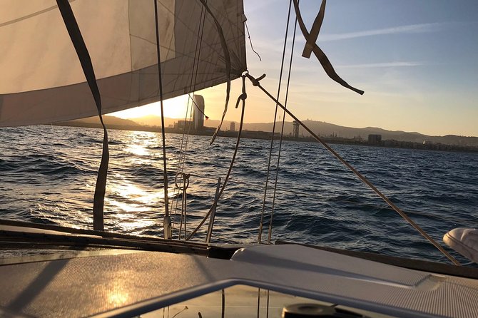 Barcelona Sunset Cruise with Light Snacks and Open Bar - Leaving the marina with a drink in hand
