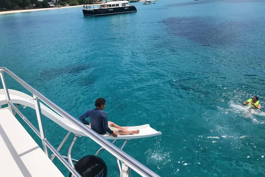 Bridgetown: Carlisle Bay Turtle and Shipwreck Boat Cruise - The slide, top deck, and juice