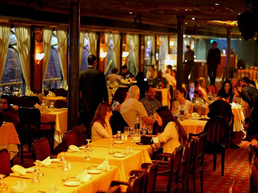 Cairo: Nile Dinner Cruise with Belly Dancer Show with Pickup - A lively night on the Nile, not a silent river cruise