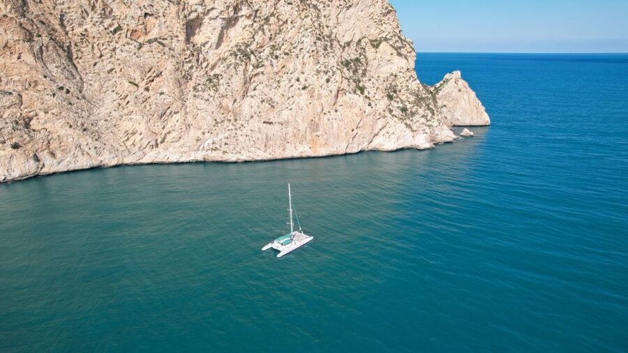Calpe: Catamaran Tour with Optional Swim Stop - A sea-level view of Peñon de Ifach