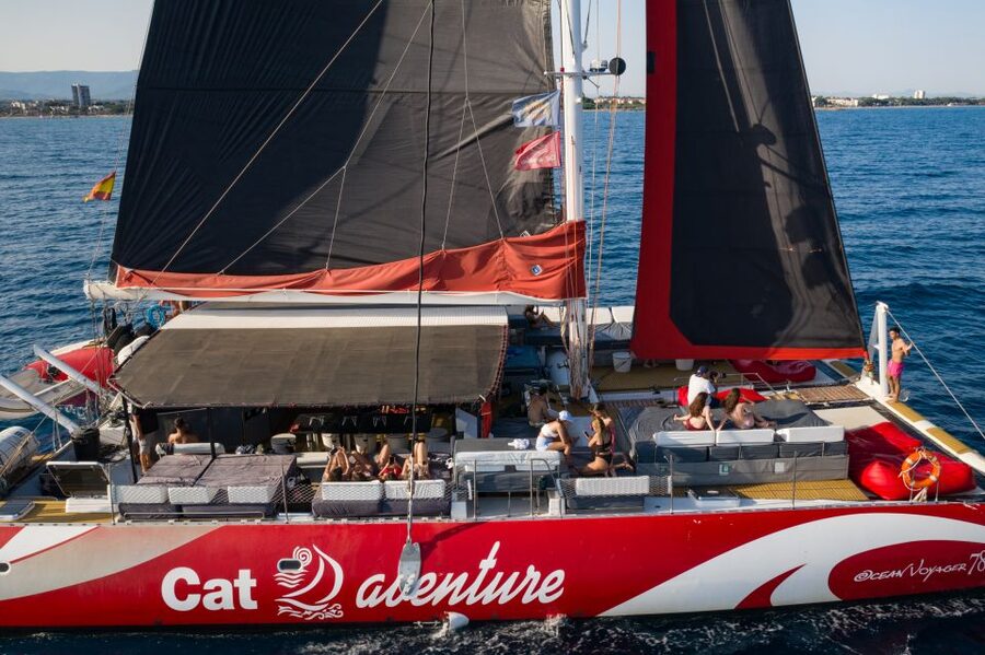 Cambrils: Catamaran Cruise with Drinks and BBQ Lunch Option - Finding your place on the wide deck