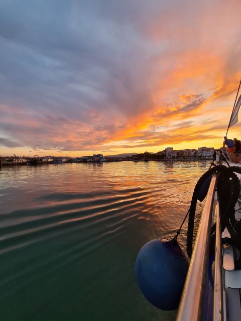 Cambrils: Costa Dorada Sunset Catamaran Cruise with Drinks - Sunset timing, weather, and what to wear
