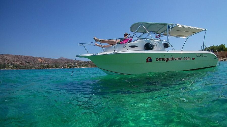 Chania: Boat Trip with Guided Snorkeling & Stand-Up Paddling - Fruit, water, and a relaxed boat setup