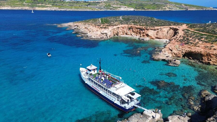 Comino: Blue Lagoon & Caves Boat Cruise - The slide, jumping points, and deck life