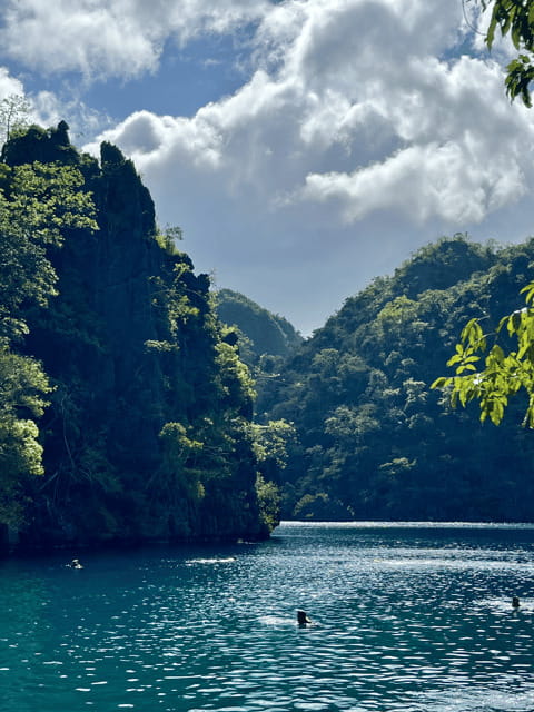 Coron: Private Boat Hire with Guided Tour and Lunch on Beach - Coral gardens and reef time