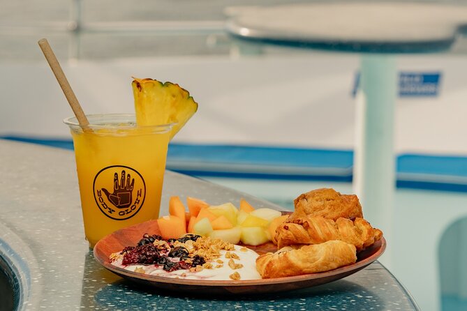Deluxe Snorkel & Dolphin Watch Aboard a Luxury Catamaran from Kailua-Kona - Slides, jump platform, paddleboards, and floating mats