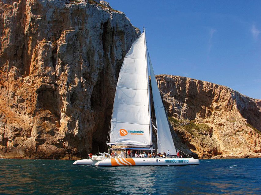 Dénia & Jávea: Portixol Sailing Catamaran Excursion with BBQ - Leaving Dénia port in the morning