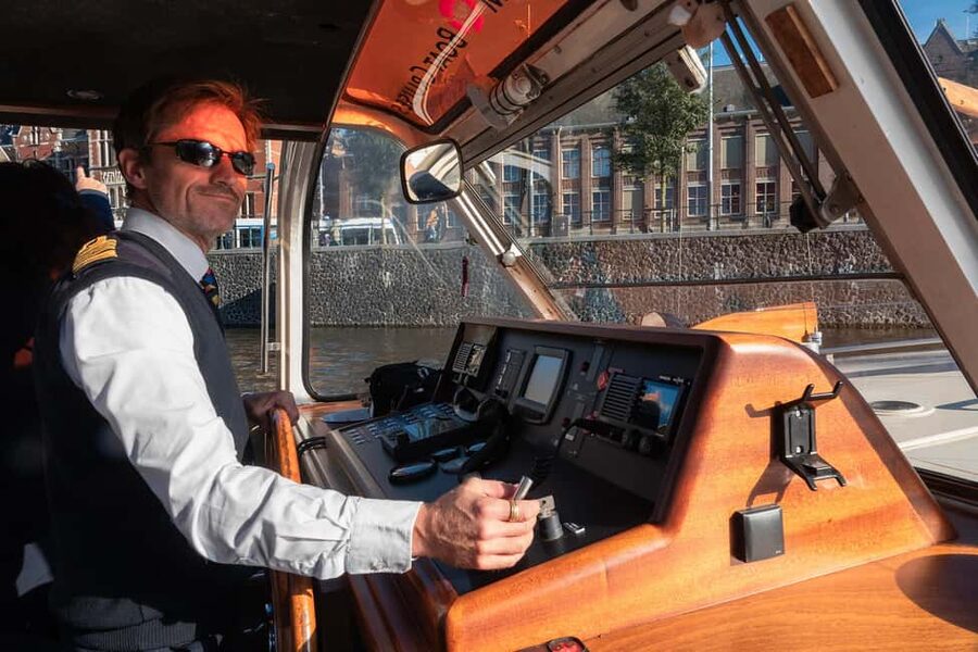 Discover Amsterdam: Luxury Canal Cruise with a Local Skipper - Live captains are the main attraction