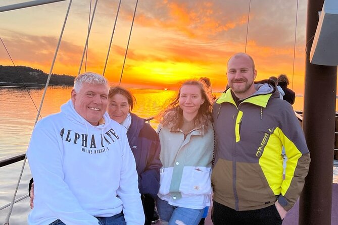 Dolphin Watching & Sunset Boat Tour With Dinner and Drinks - Leaving Pula through the historic bay