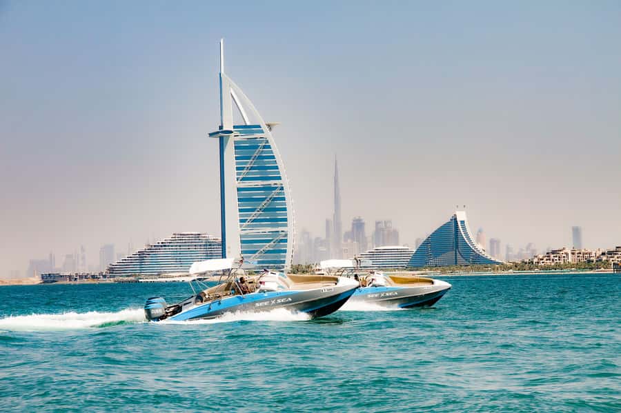 Dubai: Marina Private Boat Tour & Palm Jumeirah Sightseeing - Captains, commentary, and the personal soundtrack