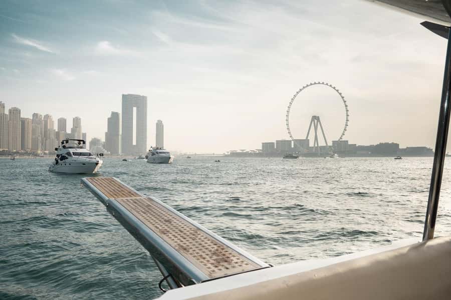 Dubai: Sunset & Night Cruise with Bites and Drinks - Crew service and the shared-boat experience