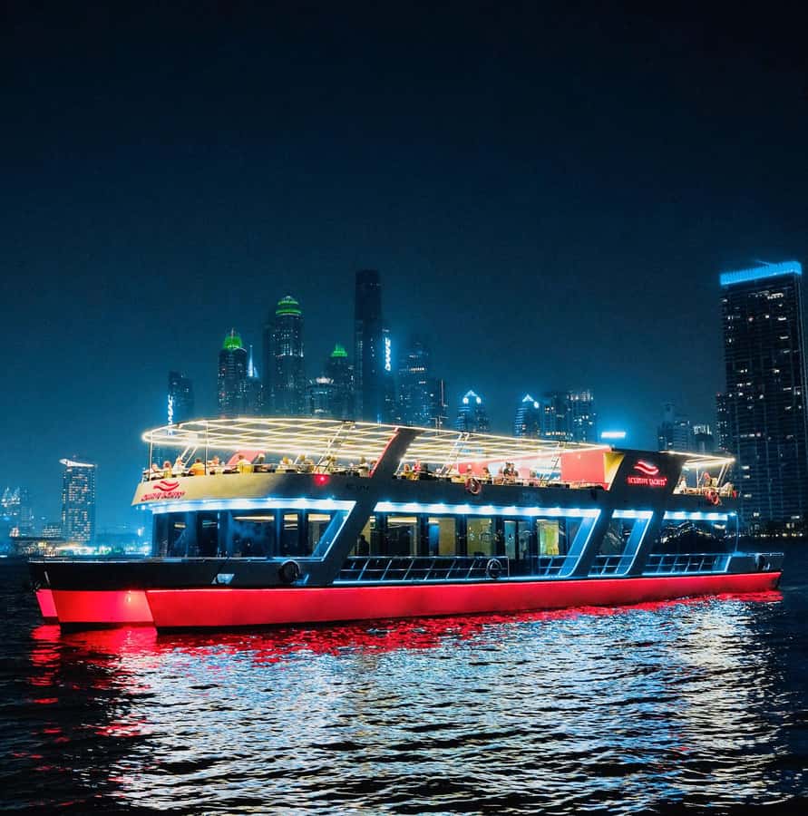 Dubai: Sunset or Dinner Cruise with Live Music & Open Bar - Boarding, assigned tables, and the first impression
