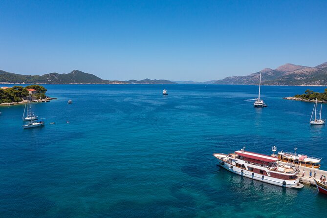 Dubrovnik: Elaphiti Islands Full-Day Cruise with Lunch - Koločep: pine trees, clear water, and a short first stop