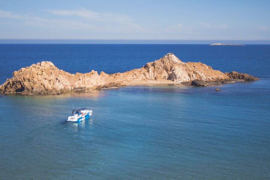Fornells: 3-Hour Boat Tour Along Menorcan Coast - The eastern route: red beaches, caves, and clear water