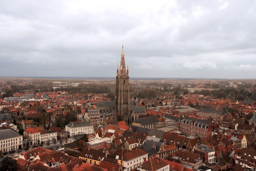 From Amsterdam: Bruges Day Trip in English with Boat Option - Meeting at Aloha and settling into the coach
