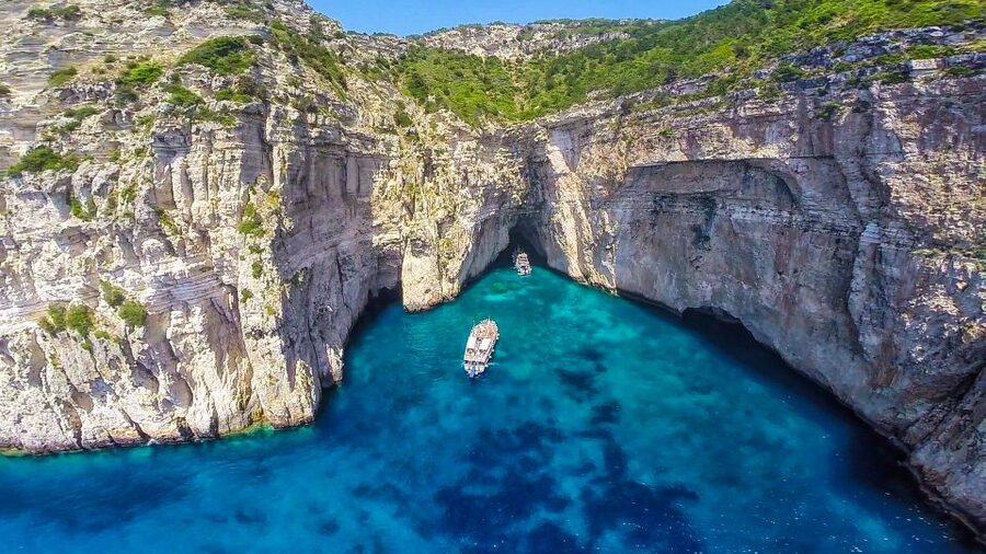 From Corfu: Day Cruise to Paxos, Antipaxos, and Blue Caves - Sailing from Corfu port past the old town