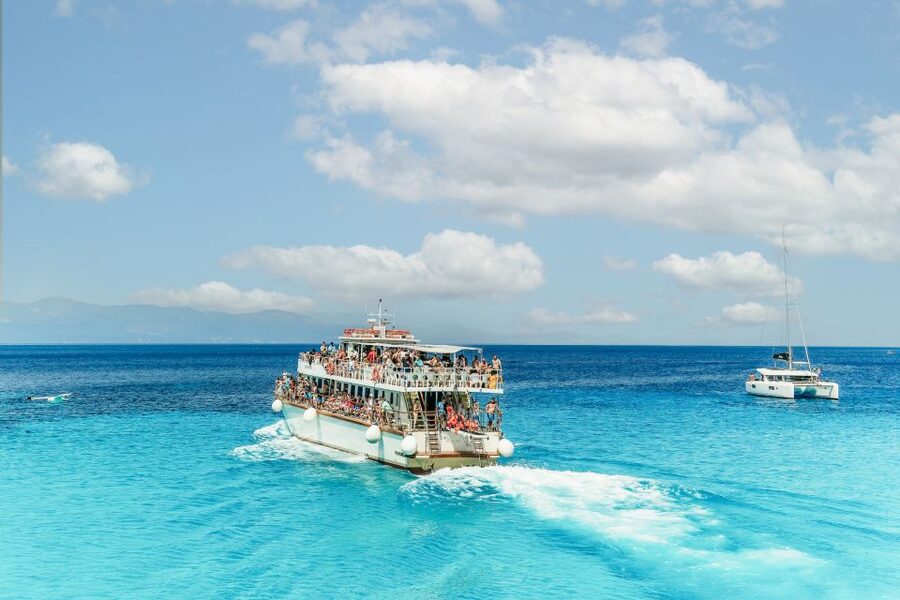 From Corfu Island: Antipaxos & Paxos Blue Caves Boat Cruise - The return trip, music, and practical comfort