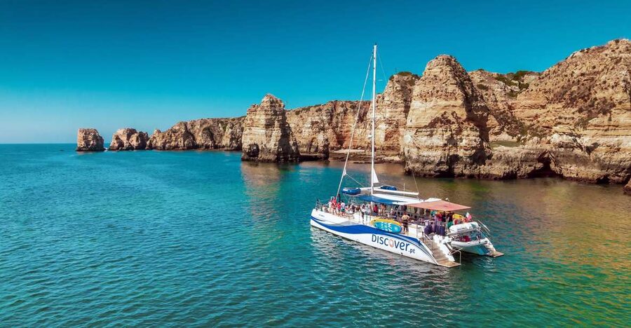 From Lagos: Algarve Golden Coast Cruise - Praia da Luz and its dark coastal rock