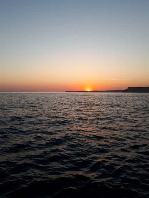 From Lagos: Ponta da Piedade Sunset Cruise with Drink - Leaving Lagos Harbor for the Algarve coast
