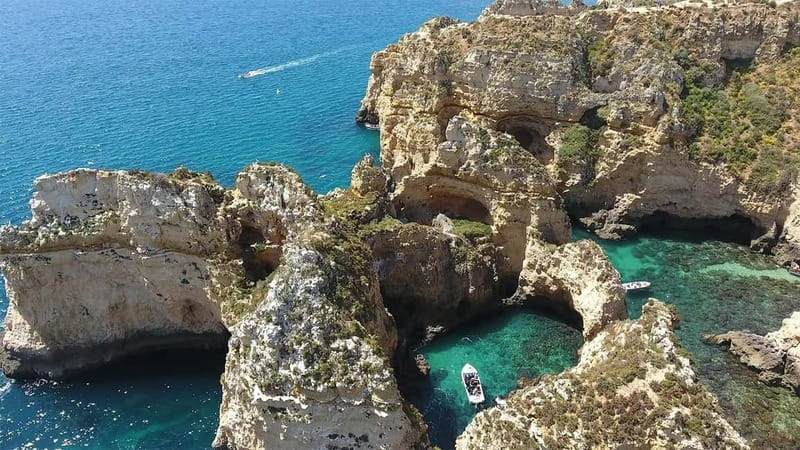 From Lagos: Ponta da Piedade Sunset Cruise with Drink - The swim stop near the rock formations