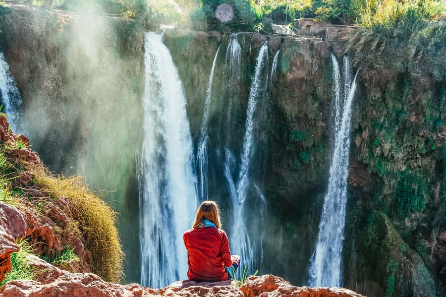 From Marrakech: Ouzoud Waterfalls Guided Hike and Boat Trip - A traditional boat beneath the cascade