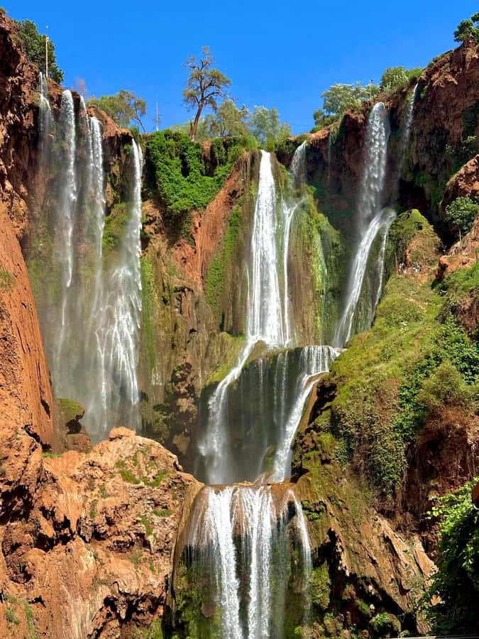 From Marrakech: Ouzoud Waterfalls guided trip with boat ride - The boat ride brings you into the spray