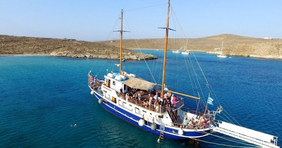 From Mykonos: Delos & Rhenia Islands Half-Day Trip by Boat - Rhenia: clear water, rocky edges, and a long swim stop