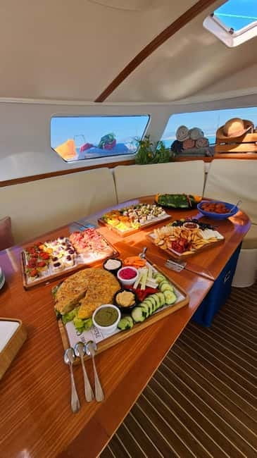 From Palma: Luxury Catamaran Group Tour with Tapas & Drinks - A quiet alternative to the party boat