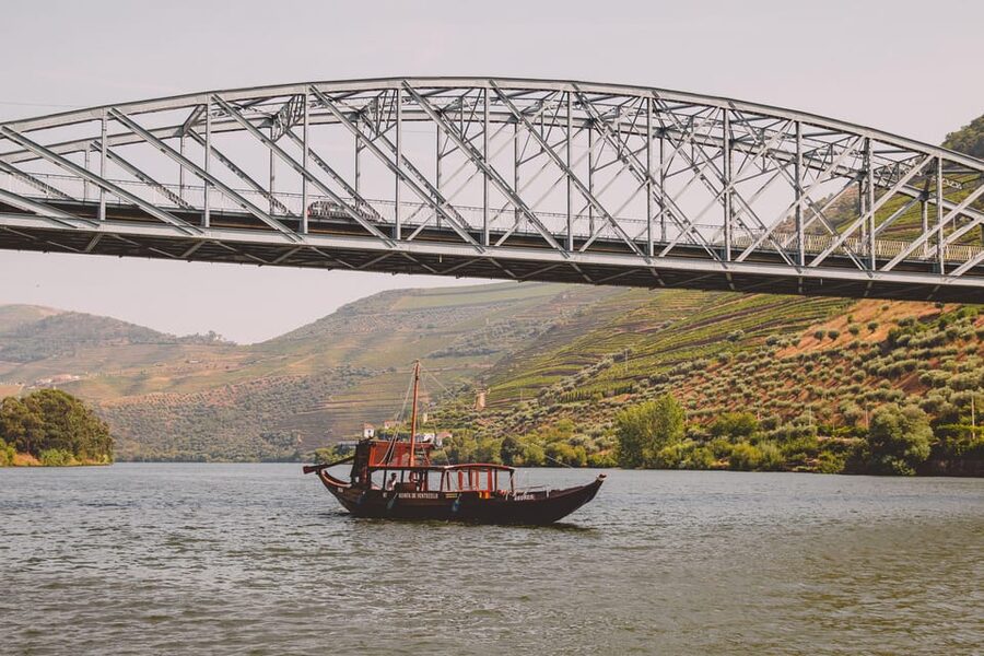 From Pinhão: Douro Valley Rabelo Boat Tour with Port Wine - Setting out from Pinhão and crossing under the Eiffel Bridge
